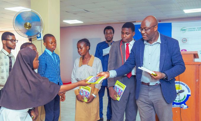 Prof chukwumerije Handing the Climate Edu
